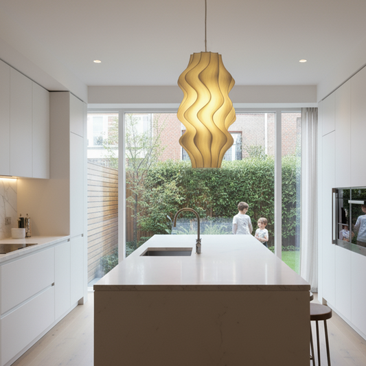 Modern kitchen with a Iris pendant light and a view of a garden.