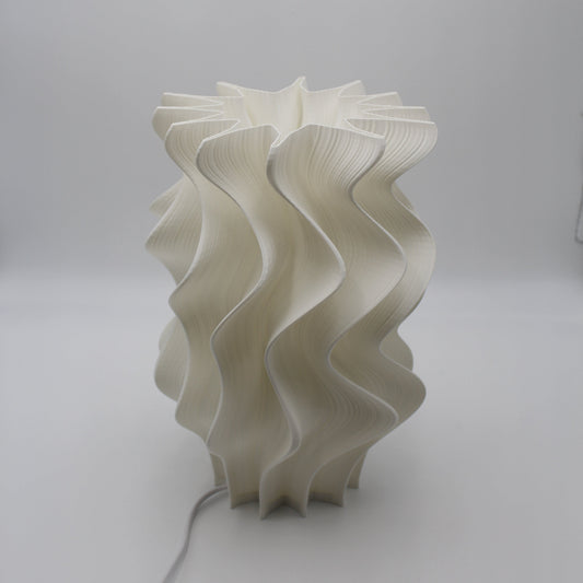 White wavy lampshade on a plain background