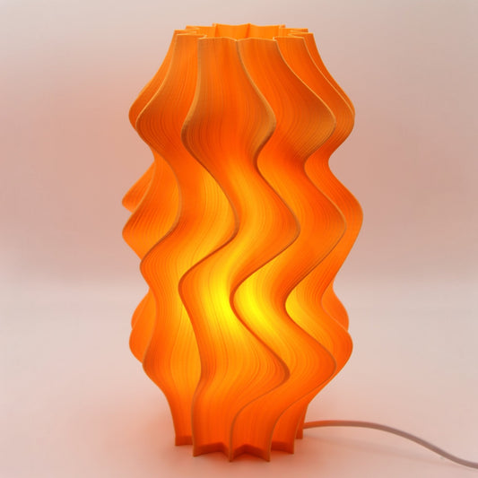 Orange wavy table lamp on a light background