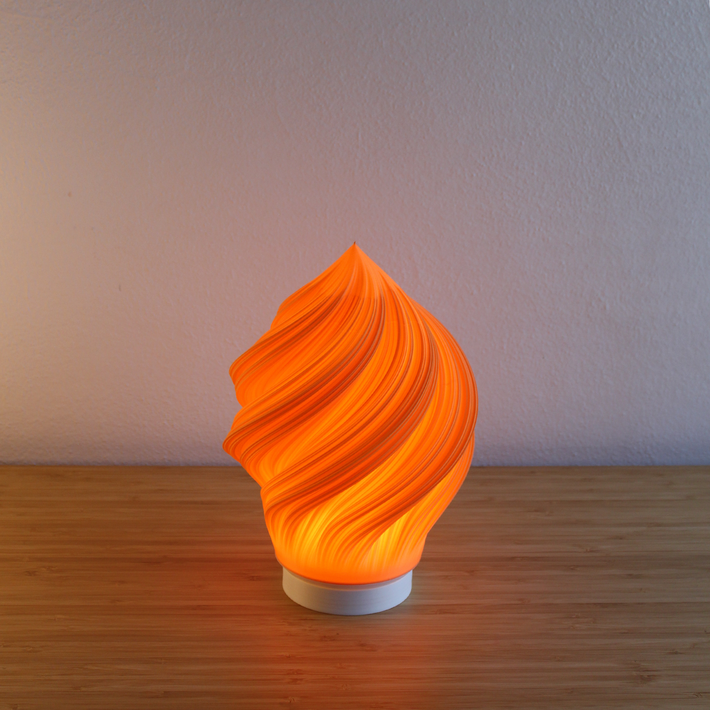 Mandarin Portable Soft Serve Lamp, 24cm high, offering a playful, dimmable 3000K glow. Cordless, sustainable recycled PLA for unique home decor.