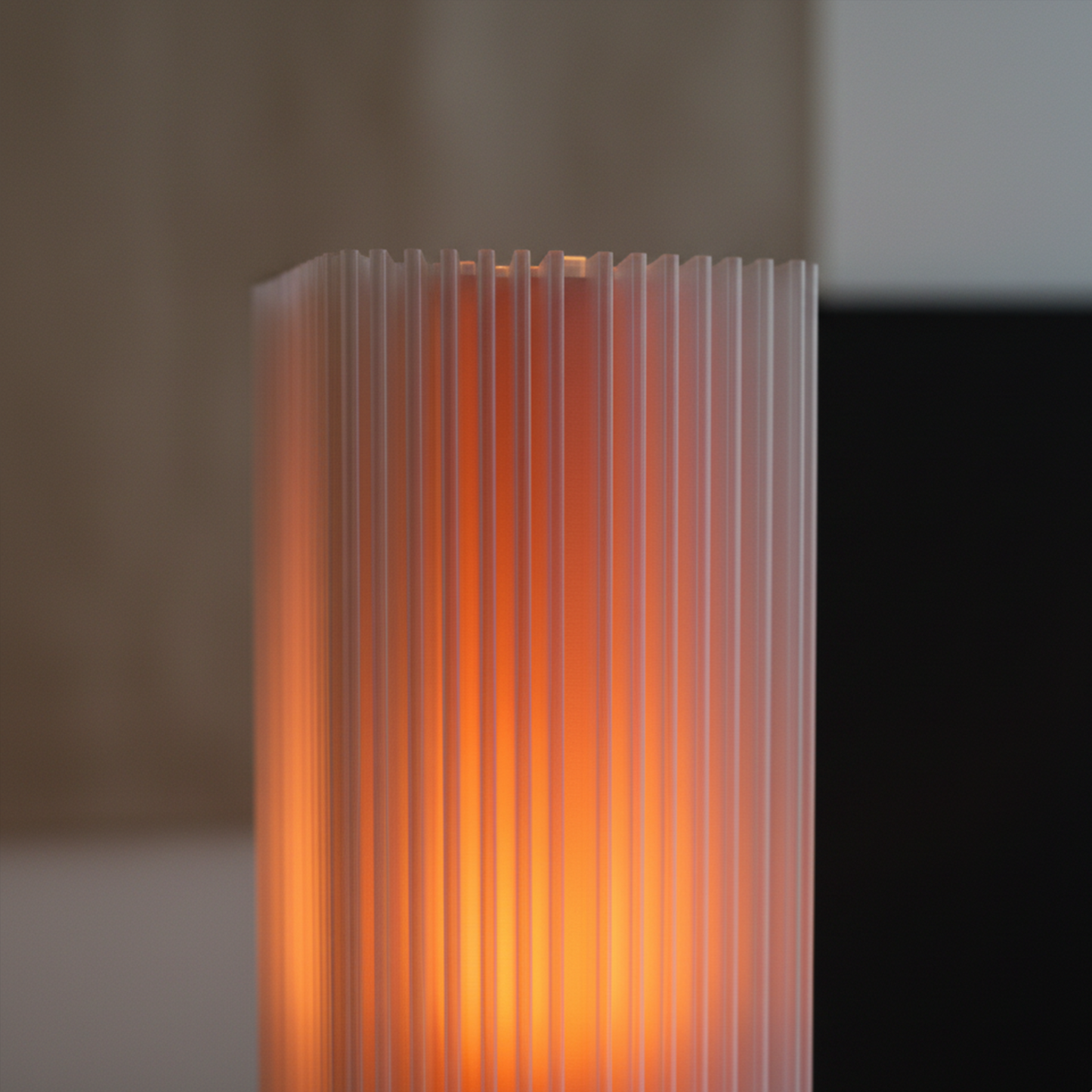 Close-up of Shard Lamp in orange glow, highlighting shard-like ridges and translucent 3D printed texture.