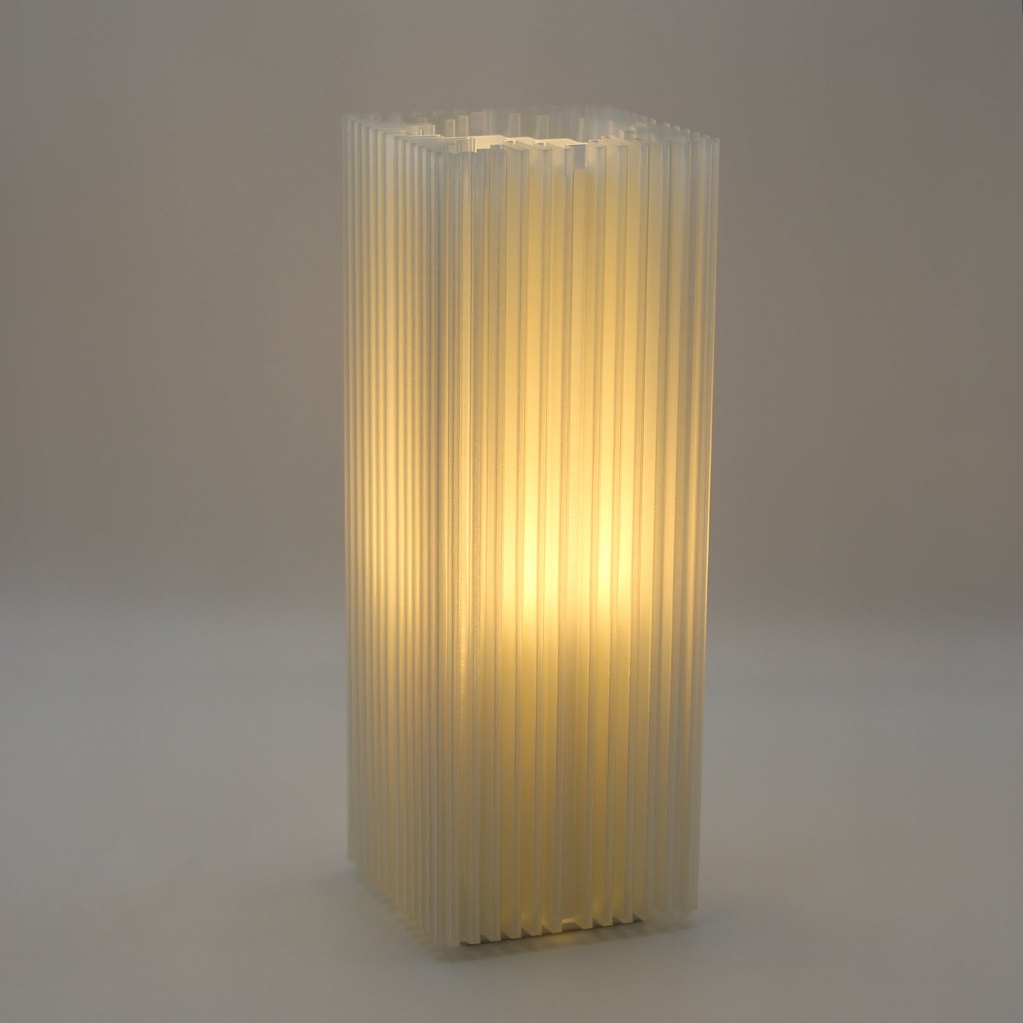 Close-up of ridged shard-like texture of lamp, diffusing light through translucent PLA shell