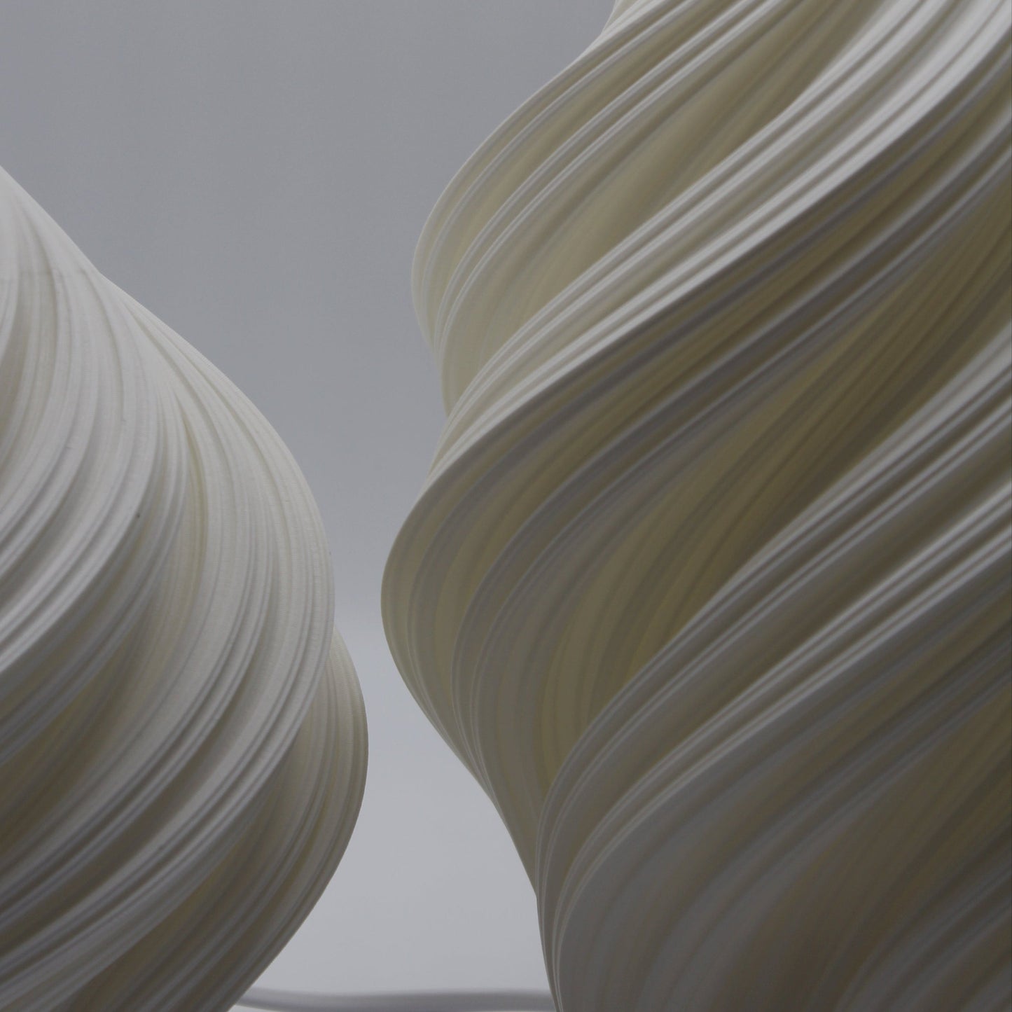 White sculptural bedside lamp, Soft Serve Lamp by Namami Studio, sustainable home lighting.