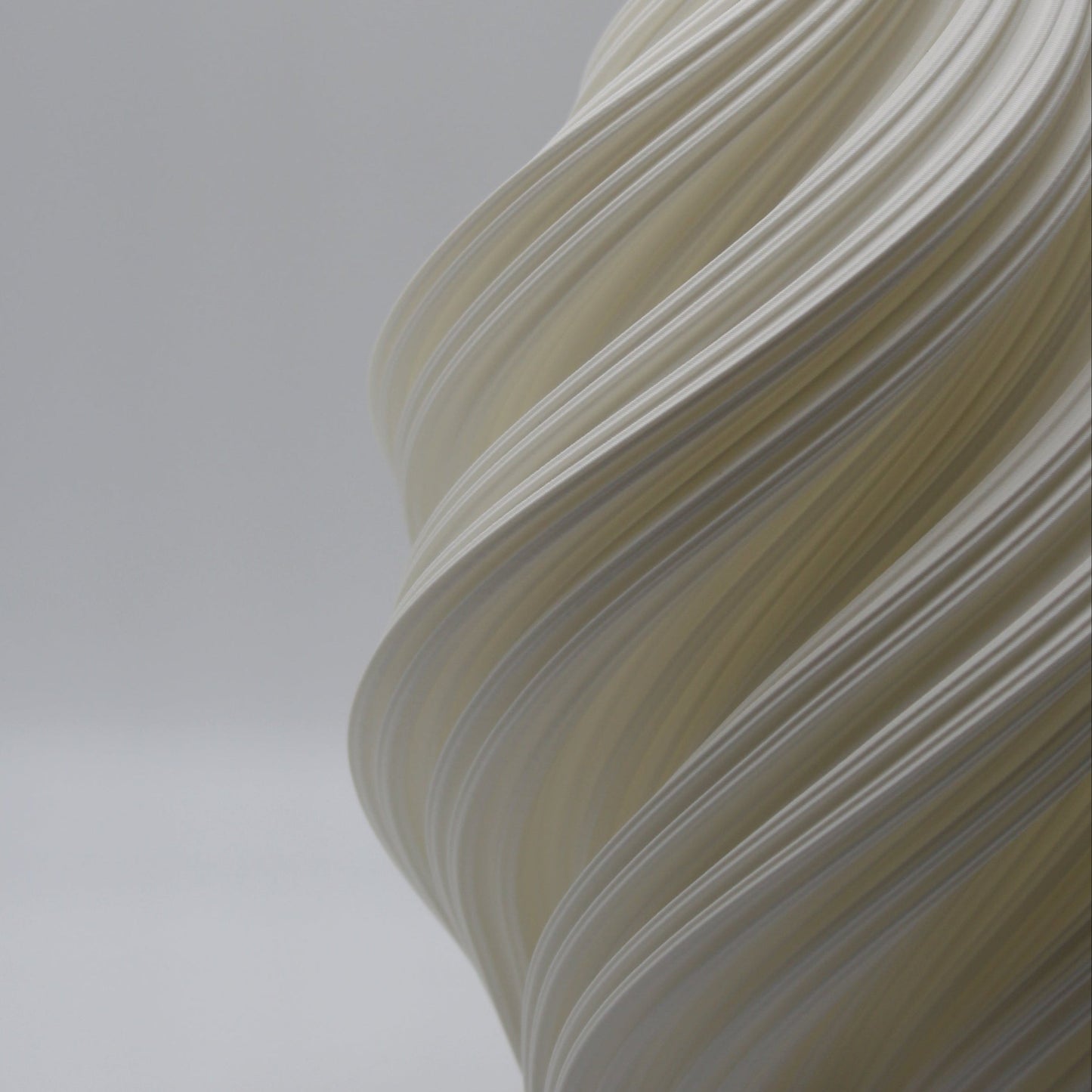 Close-up of the Soft Serve Lamp’s sculptural swirl texture, showing layered 3D-printed detail.
