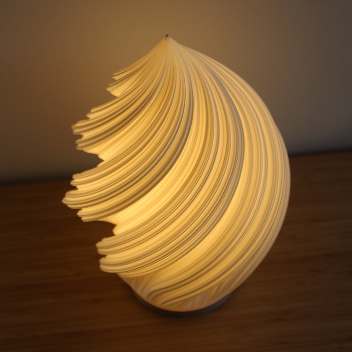 Overhead view of the Soft Serve Lamp, capturing its spiral ice cream–like form.