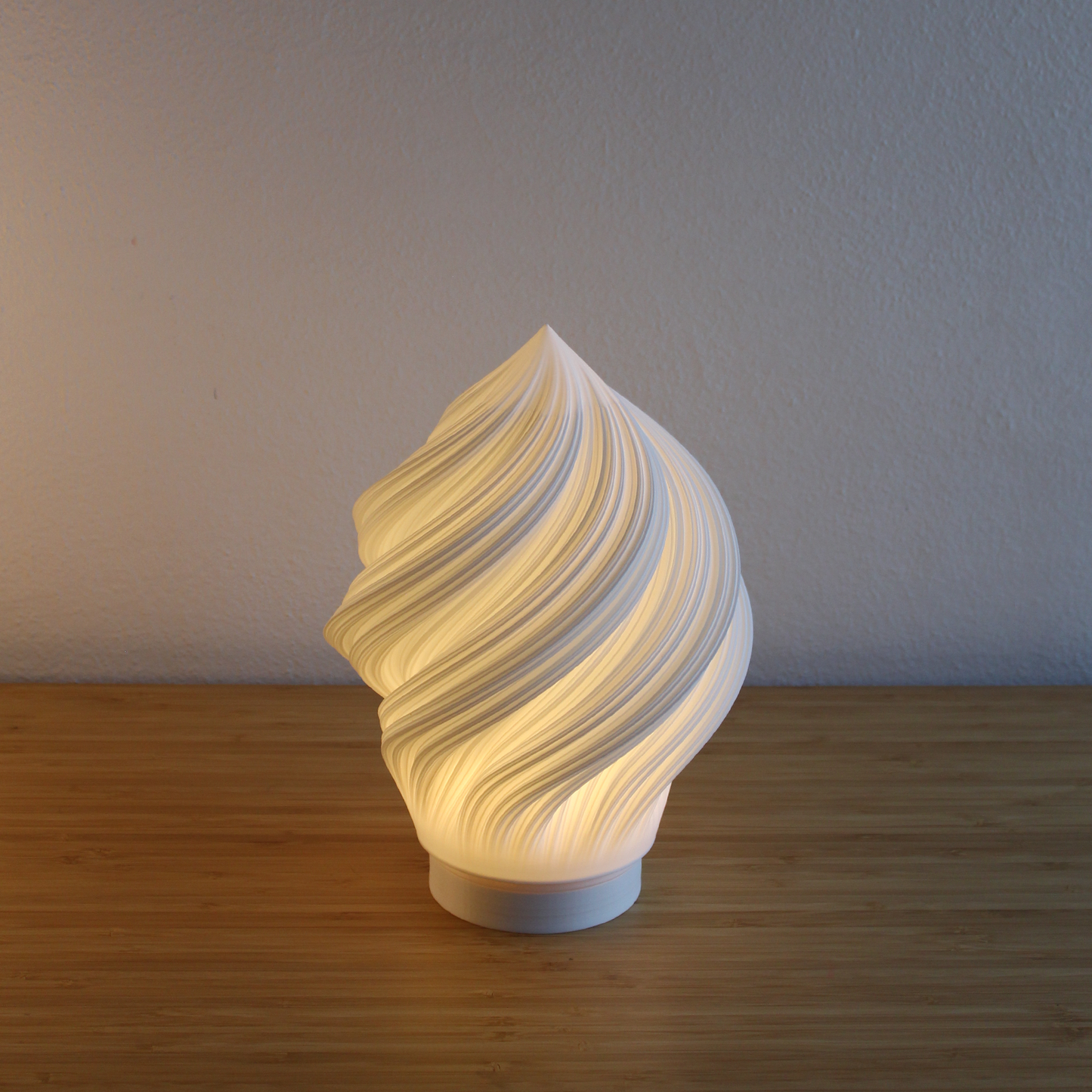 Close-up of Portable Soft Serve Lamp's unique, flowing pleated texture. Made from sustainable recycled PLA in Melbourne. Highlights material quality.