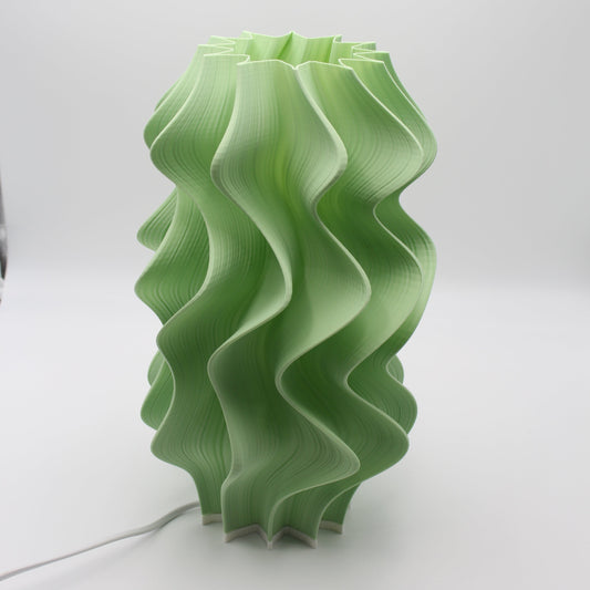 A soft pistachio-colored Iris lamp, cropped at the top, showing the unfinished, raw form.