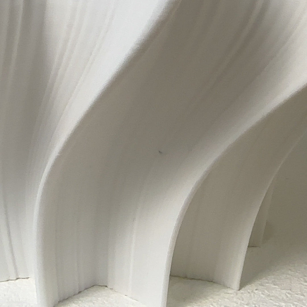 Crème Iris floor lamp, close-up of tiny black dots near the bottom