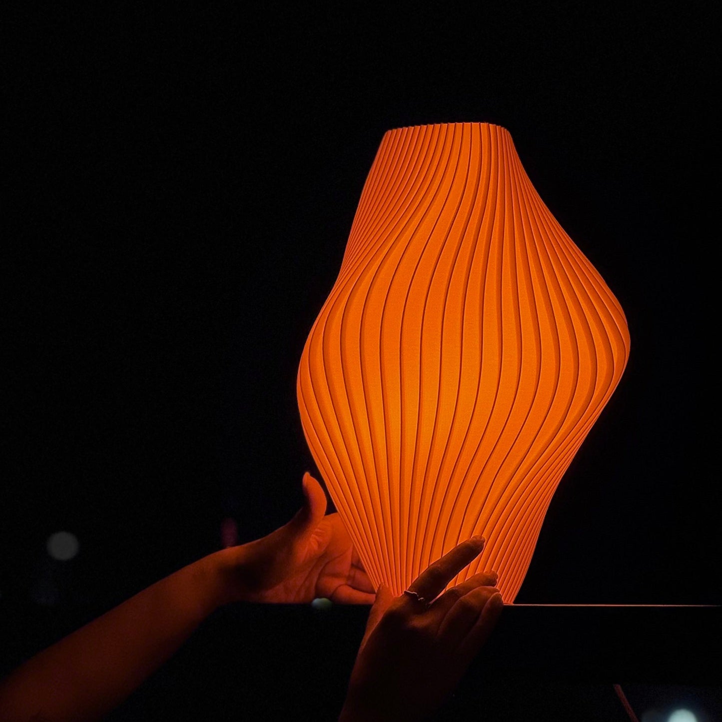 Namami Pleat Lamp as bedside light in muted interior