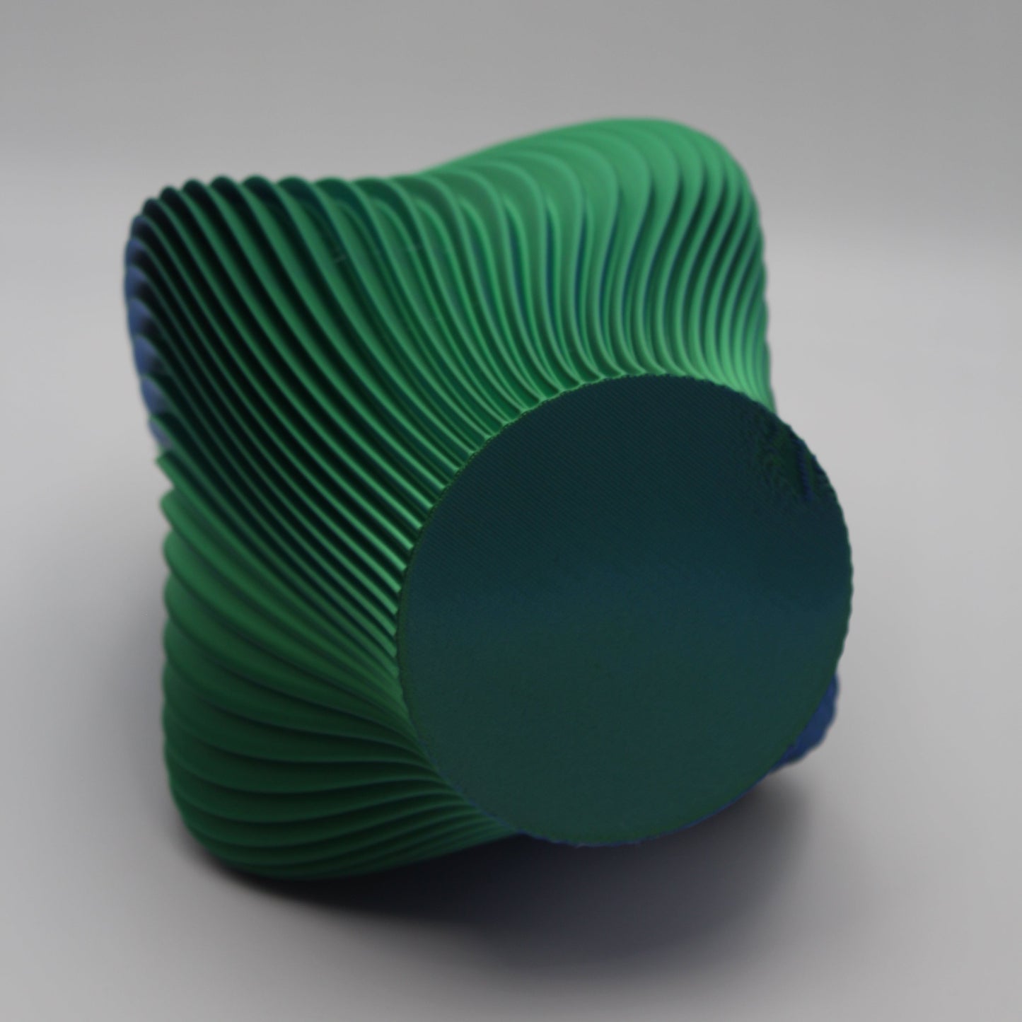 A sculptural Ripple Vase in blue/green, a seconds piece with minor cosmetic flaws.