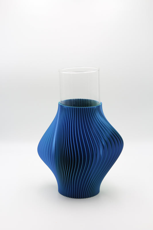 Blue pleated Ripple vase on a white background