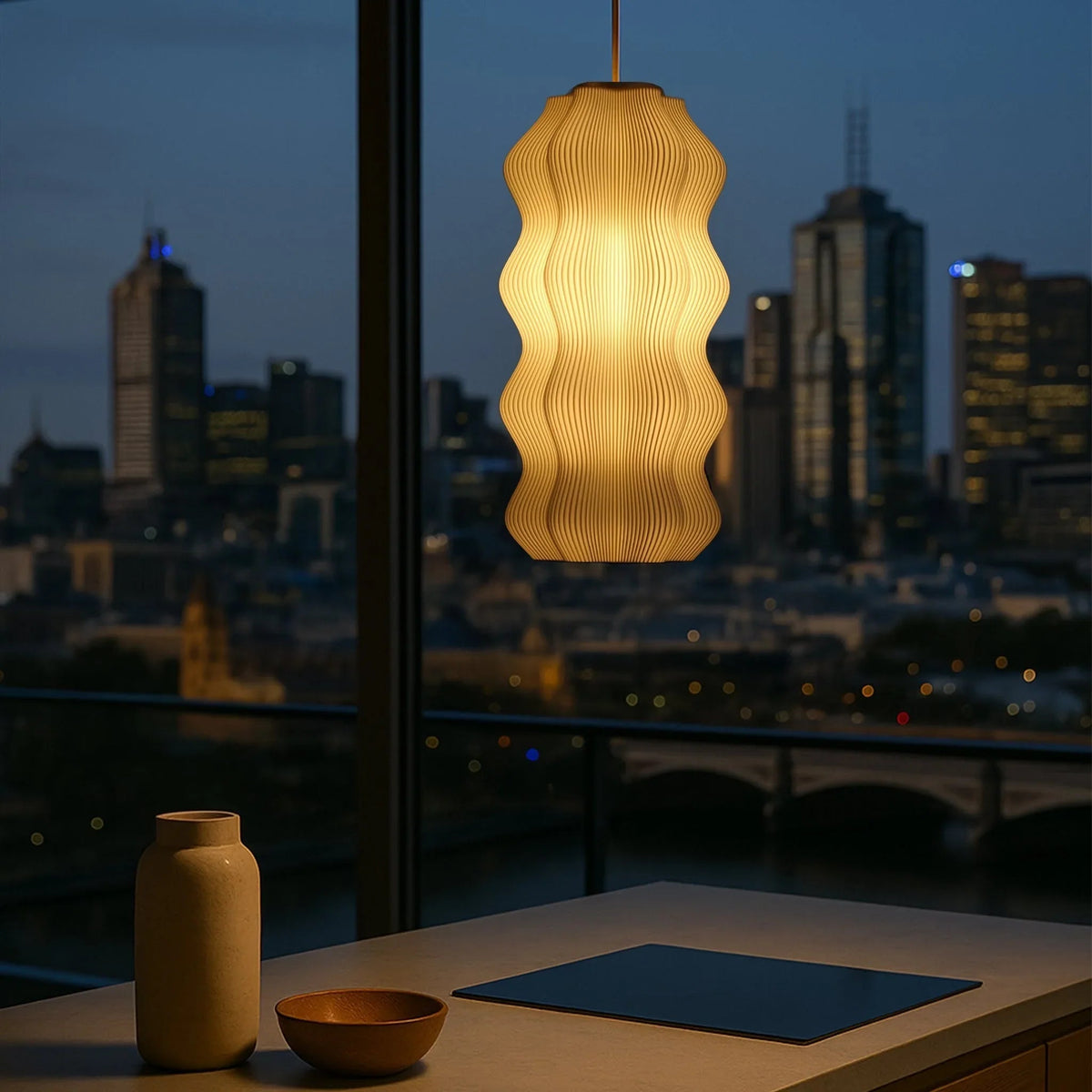 The Harp Pendant Lamp hanging in a minimalist bedroom