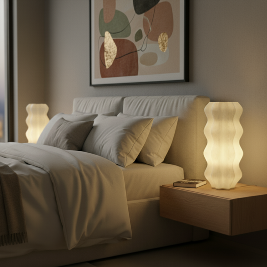 Warm glowing bedside lamp with wavy design in cozy bedroom.