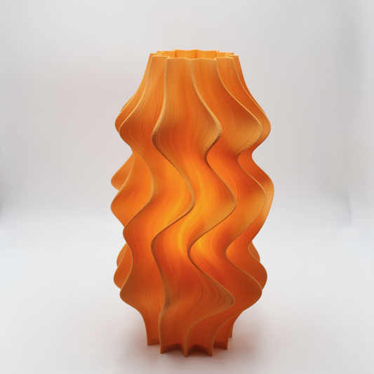 Orange wavy-patterned Namami Iris Lamp on a white background
