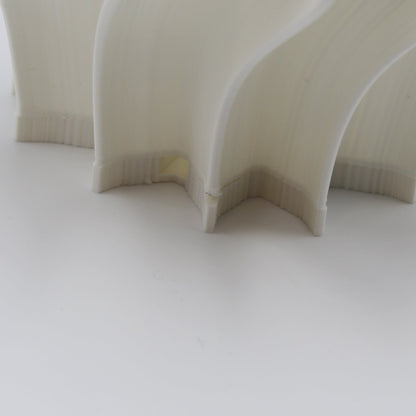 Wavy Iris creme lamp on a white background