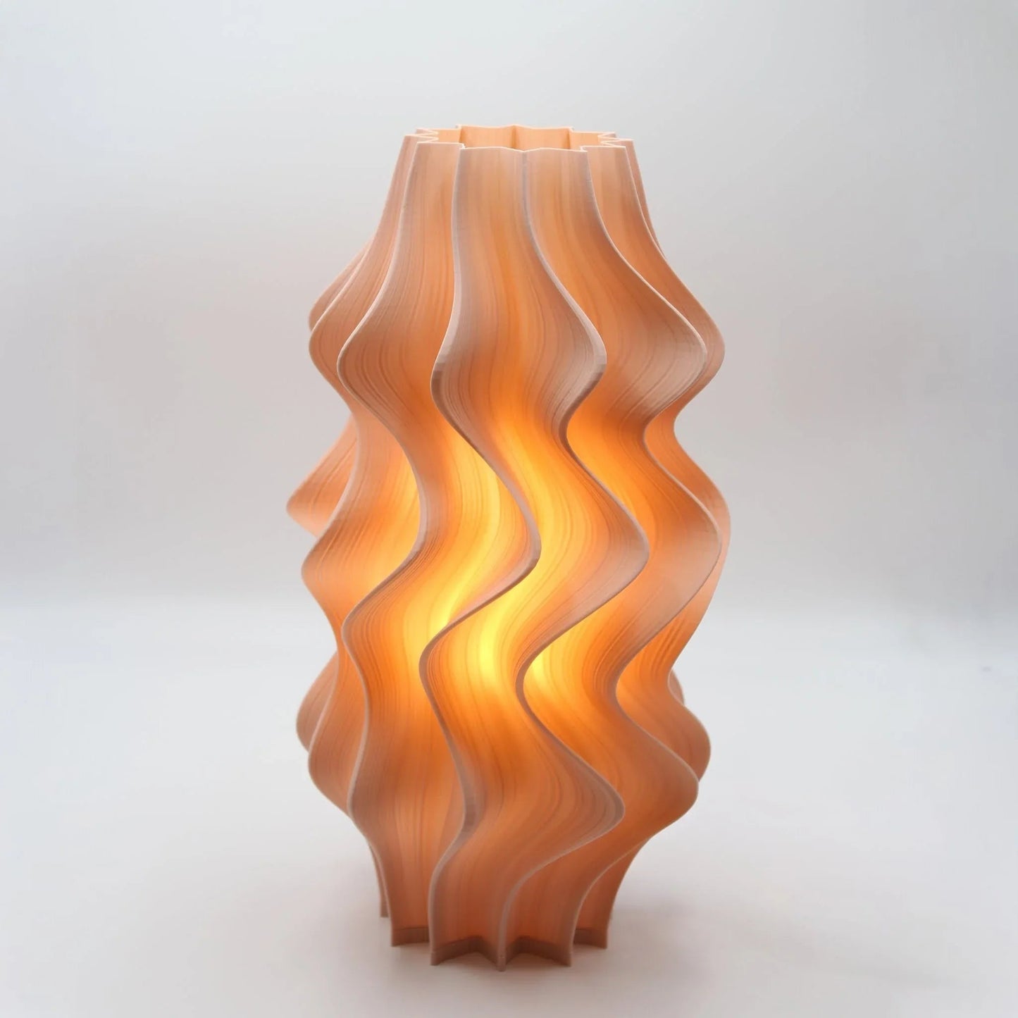 Iris Wavy-patterned lamp in Peach on a white background
