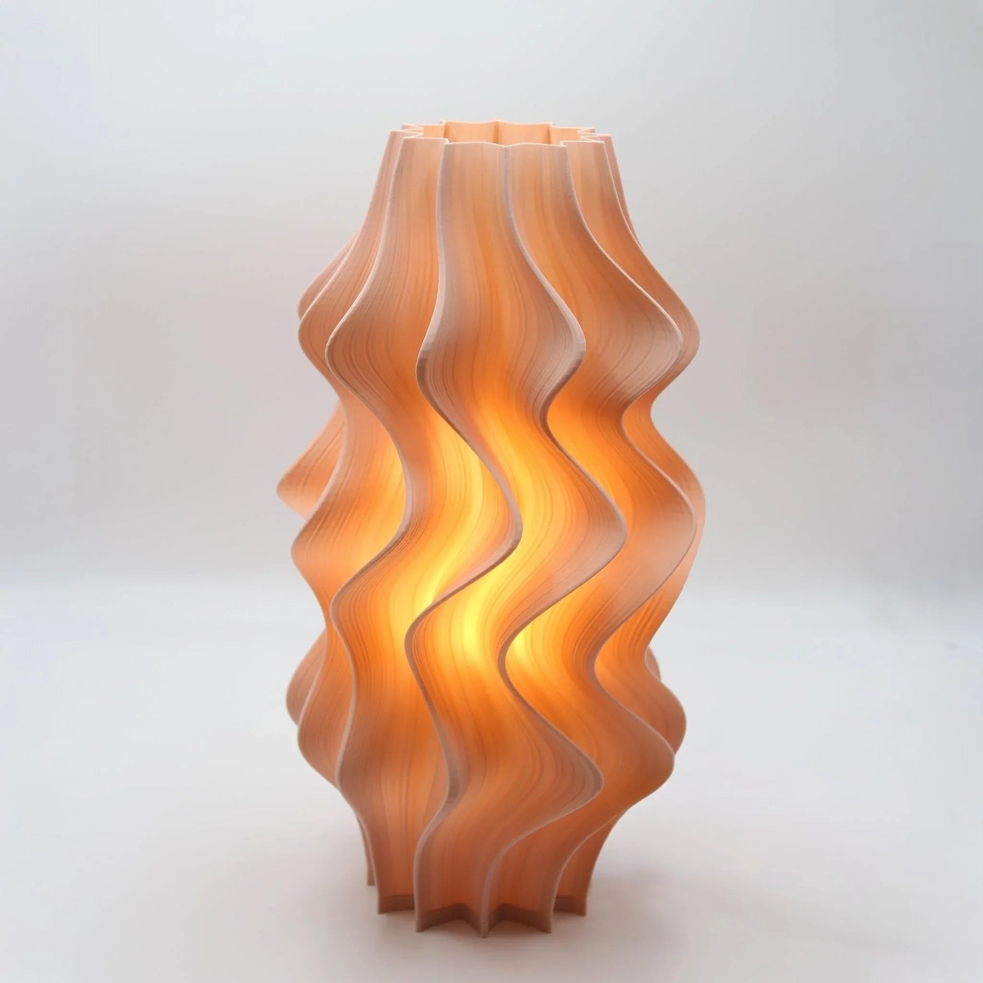 Iris Wavy-patterned lamp in Peach on a white background