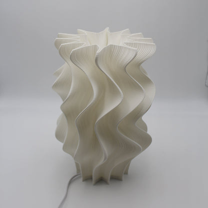 White wavy lampshade on a plain background