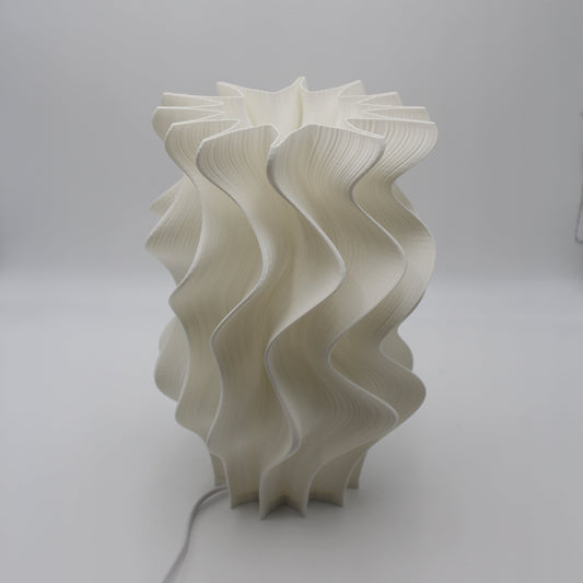 White wavy lampshade on a plain background