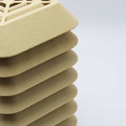 Macro detail of the Kengo Tō lamp’s surface texture, showing the refined layered pattern and smooth matte finish.