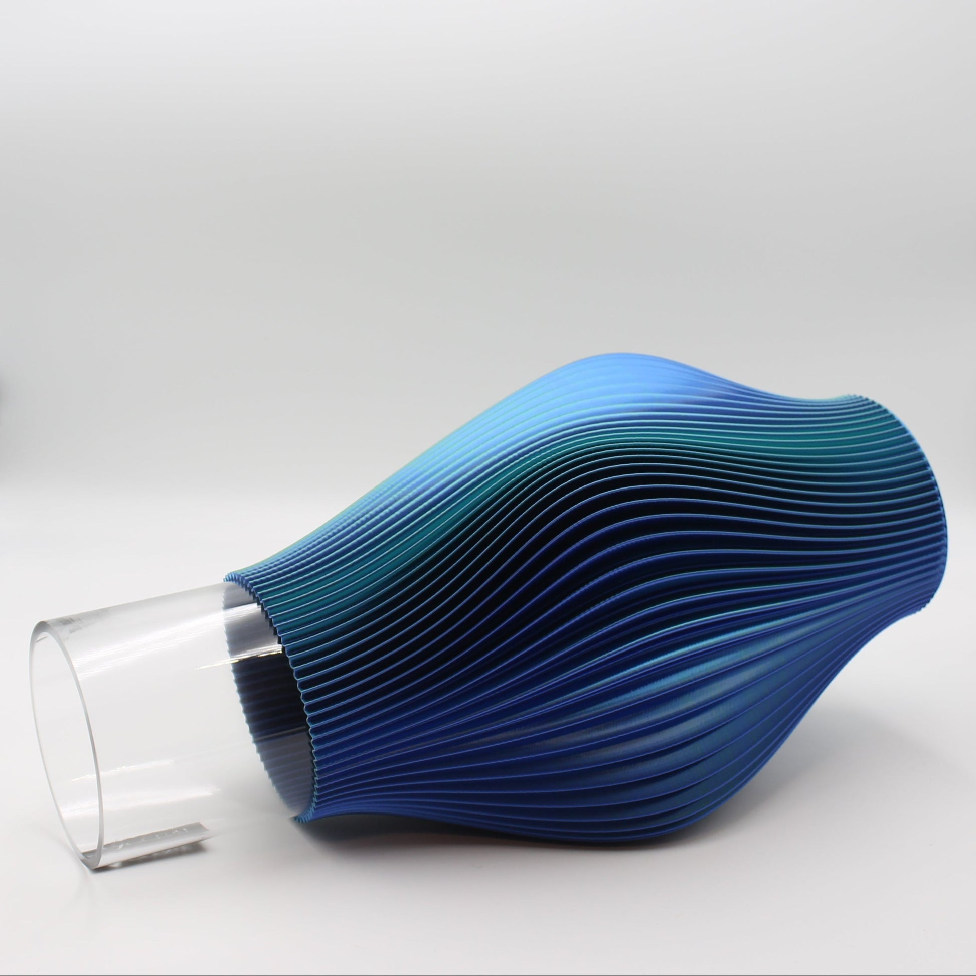 Close-up of the fluid, ripple texture on the Ripple Vase with Glass insert.