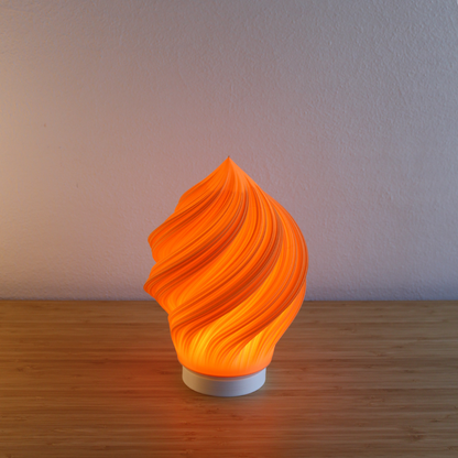 Mandarin Portable Soft Serve Lamp, 24cm high, offering a playful, dimmable 3000K glow. Cordless, sustainable recycled PLA for unique home decor.