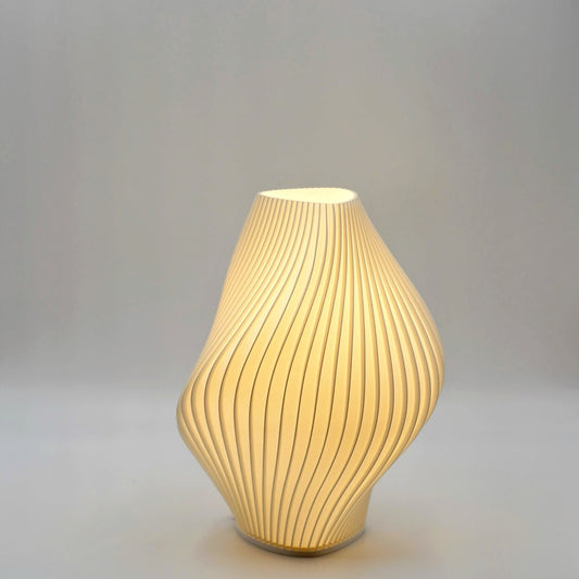Decorative Pleat small lamp with ribbed design on a gray background