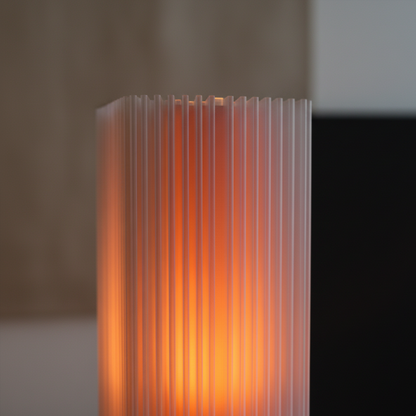 Close-up of Shard Lamp in orange glow, highlighting shard-like ridges and translucent 3D printed texture.