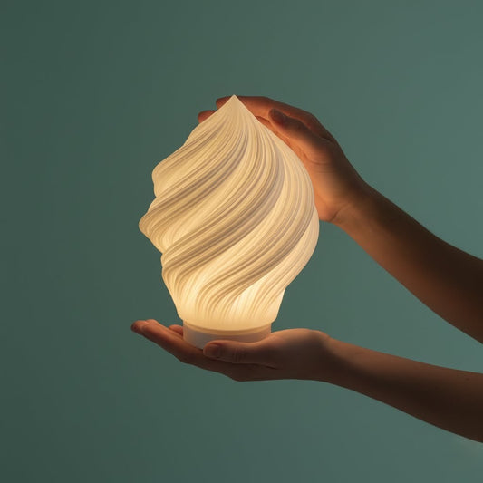 Hand holding the lightweight Portable Soft Serve Lamp, showcasing its compact size and freedom from cords. Ideal for moving light between rooms or outdoors.