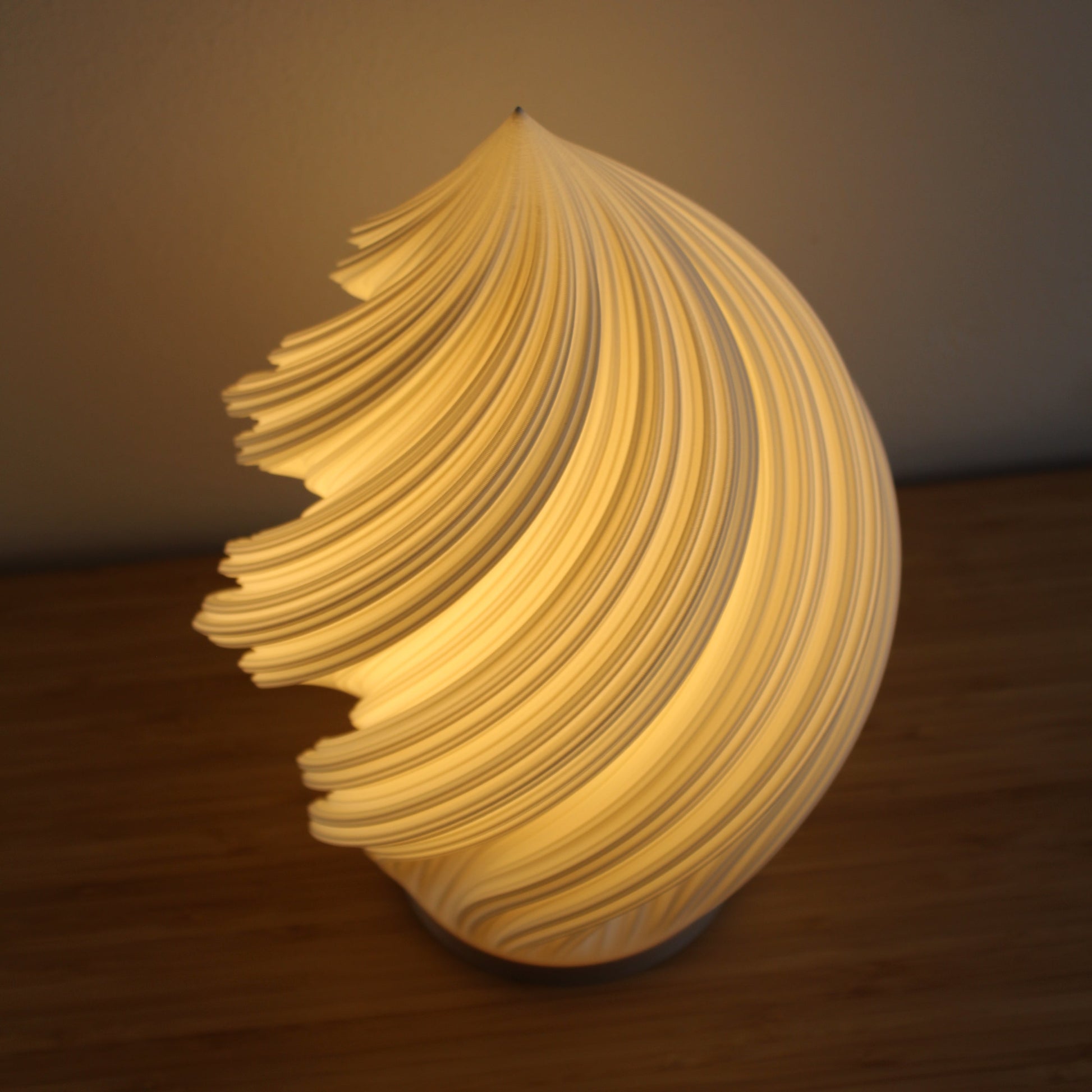 Overhead view of the Soft Serve Lamp, capturing its spiral ice cream–like form.