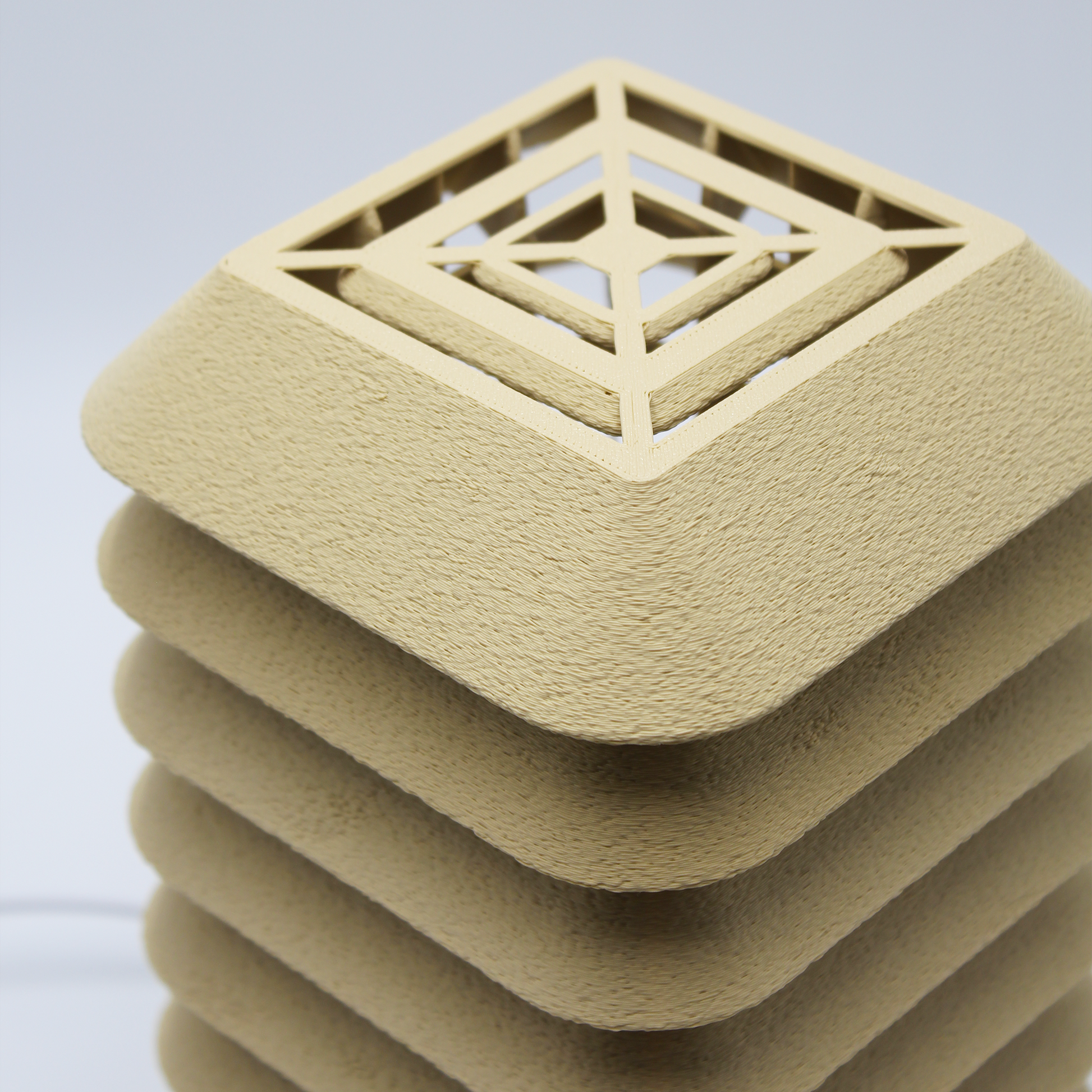 Close-up of the top lattice detail of the Kengo Tō lamp, showcasing the grid geometry and craftsmanship