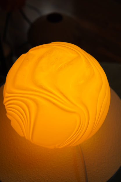 Side detail of the illuminated Lemon O4 Flow Sculpted Lamp
