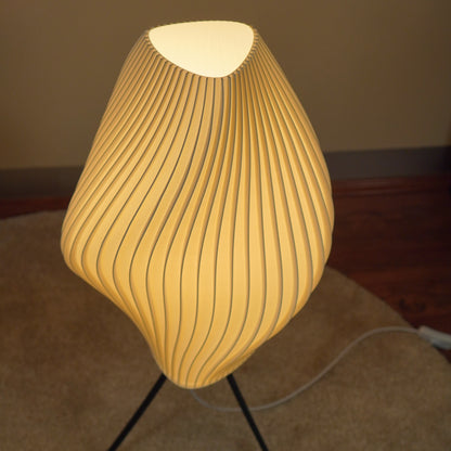 View of the top opening and pleated rim of the Crème Pleat Floor Lamp.