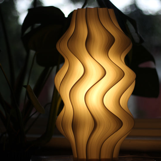 Video showcasing Namami Studio’s large white Iris Lamp with dimmable lighting in action.