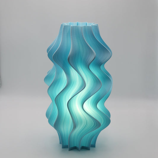 Turquoise wavy Iris Lamp on a gray background
